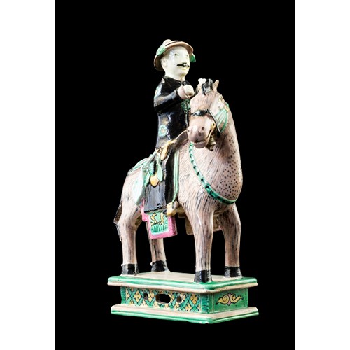 Chinese porcelain figure group of a horse and rider